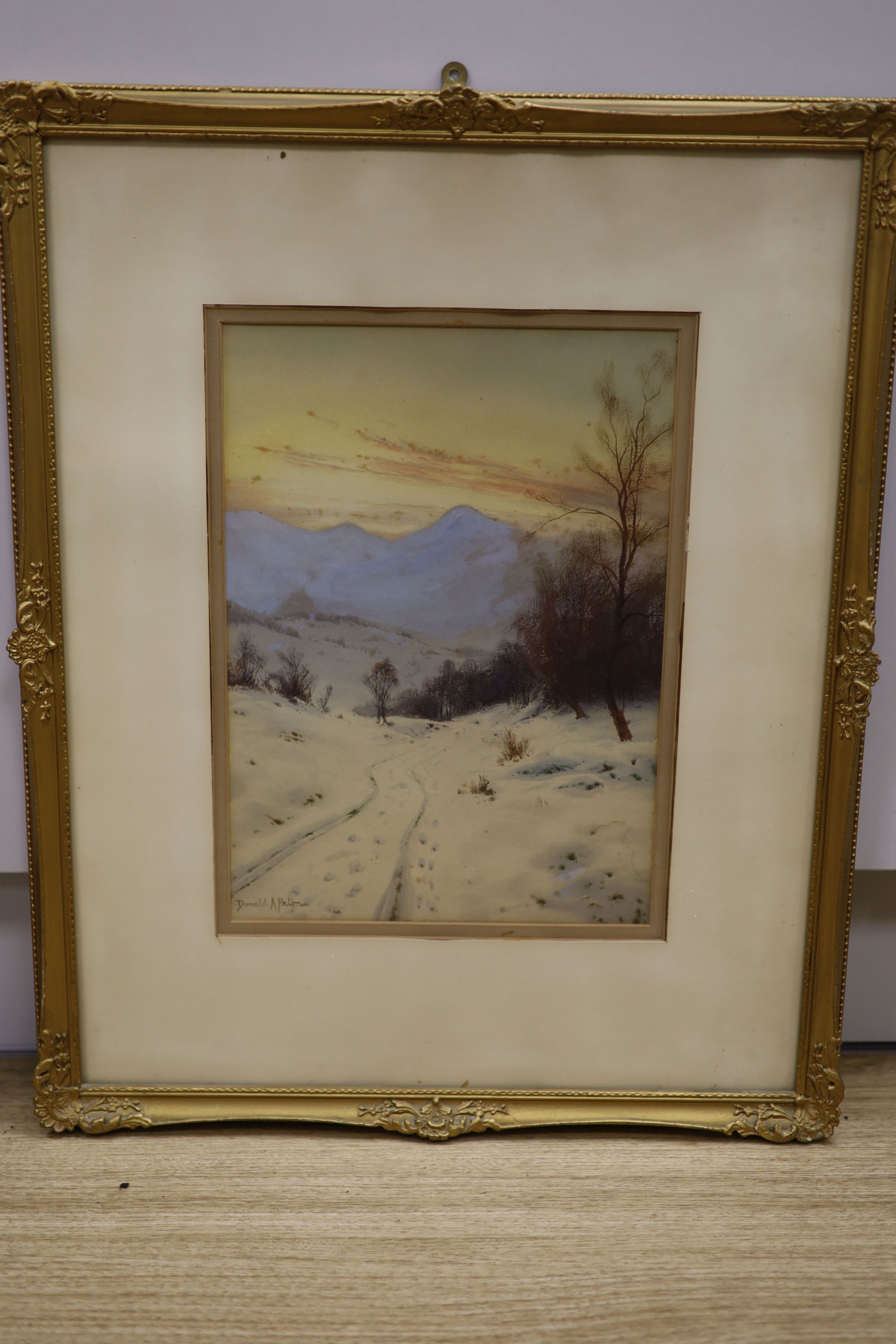 Donald A Paton (1886-1949), watercolour, ‘In the Grip of Winter, amongst the Fells, ..Lomond’, signed, 34 x 24cm.